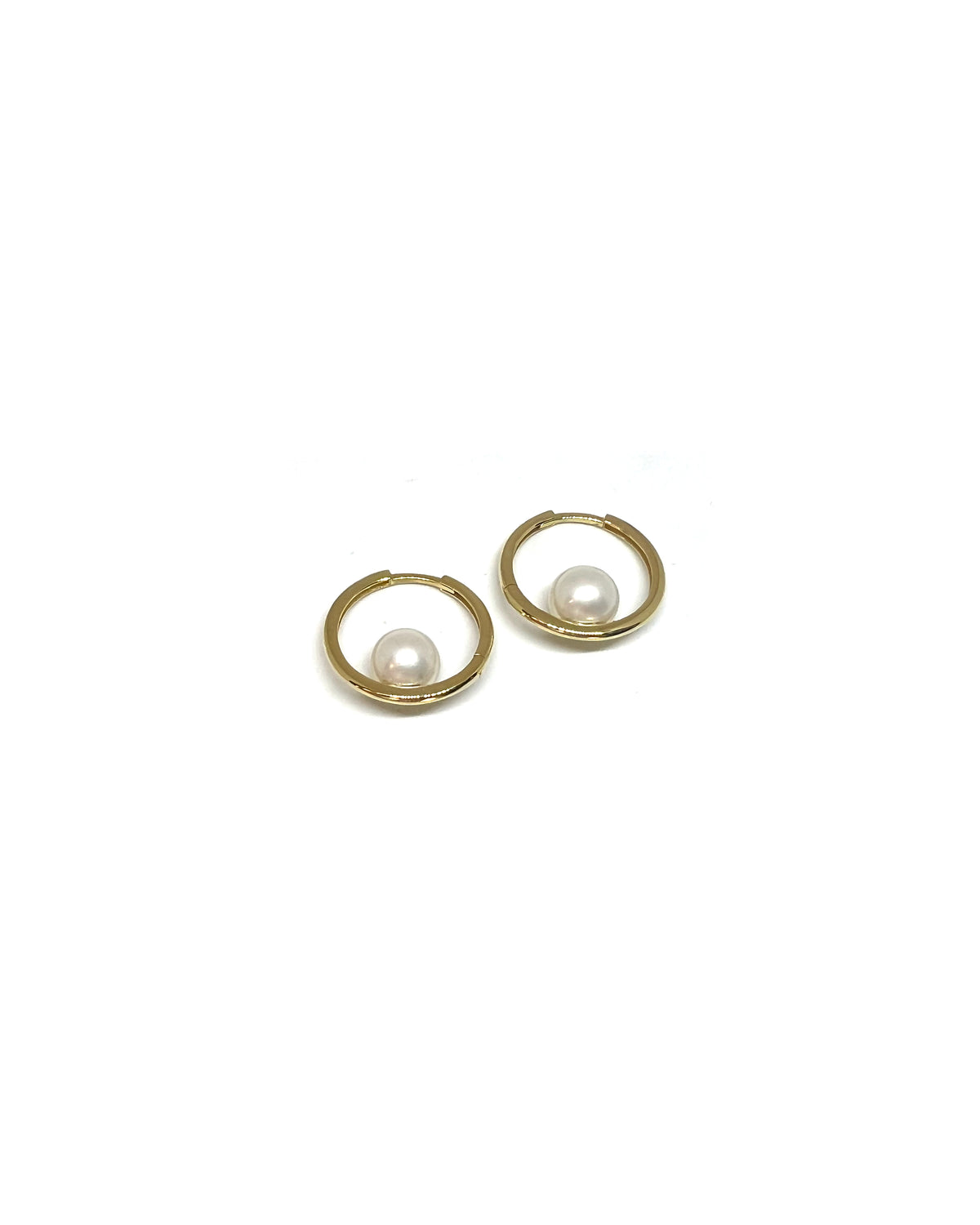 Circle Hoops with Pearls | 18-karat gold and cultured pearls. Circle Hoops with Pearls | 18-karat gold and cultured pearls.